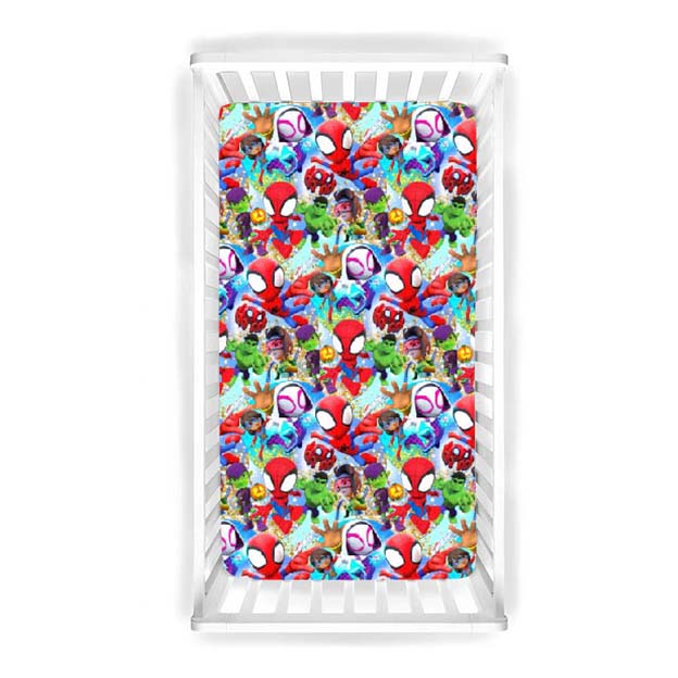 Properly fitted mini crib sheet showcasing pocket depth and tight elastic
